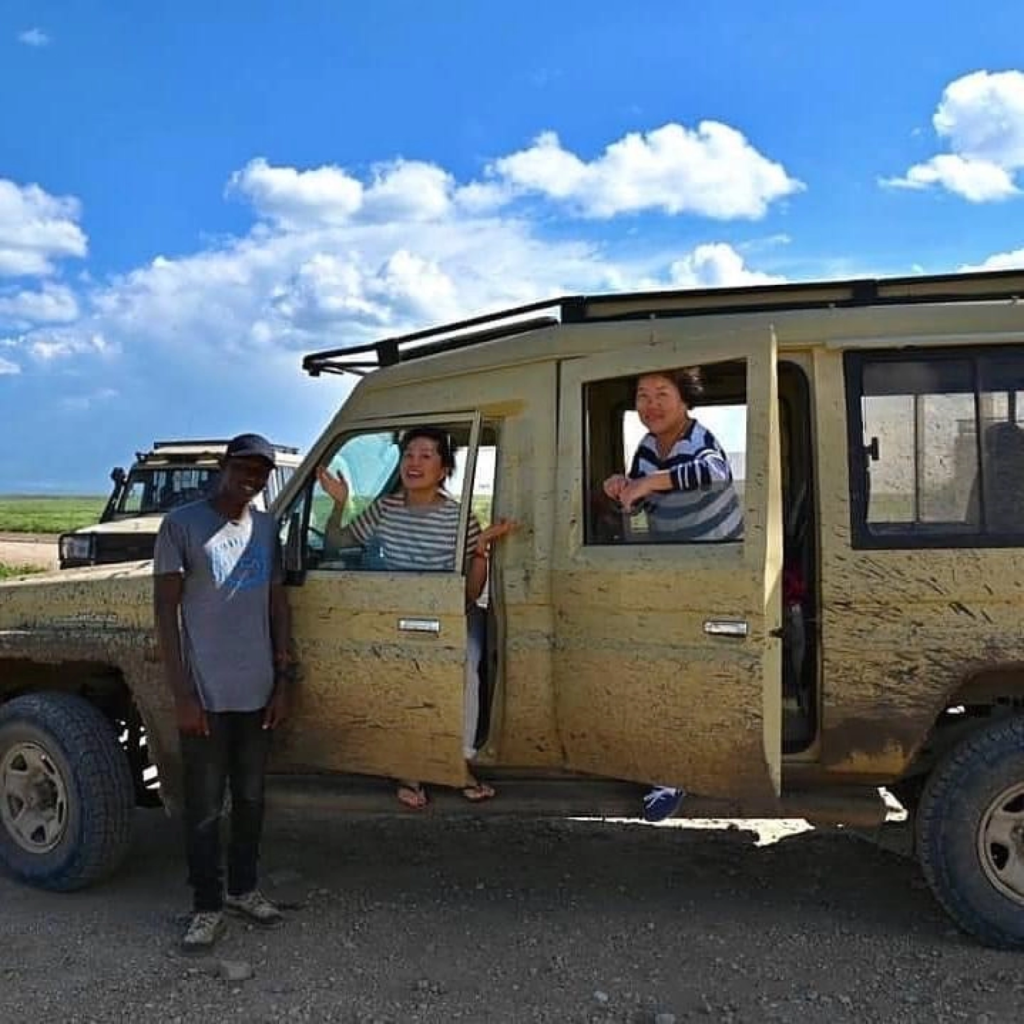 Safari vehicle and guide on departure day in Uganda